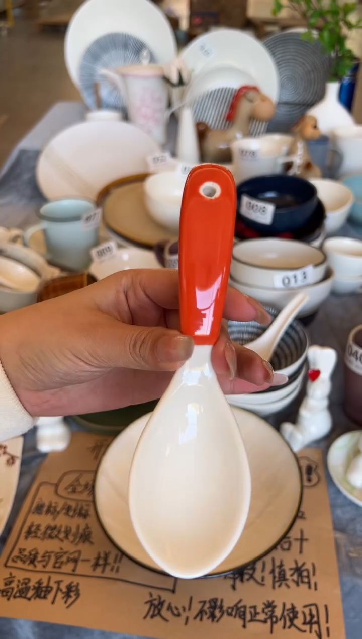 新骨瓷103瑕疵暖白橘柄勺子