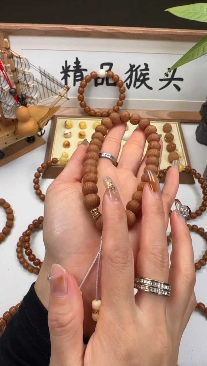 手串桃核嘚*驾911凤羽