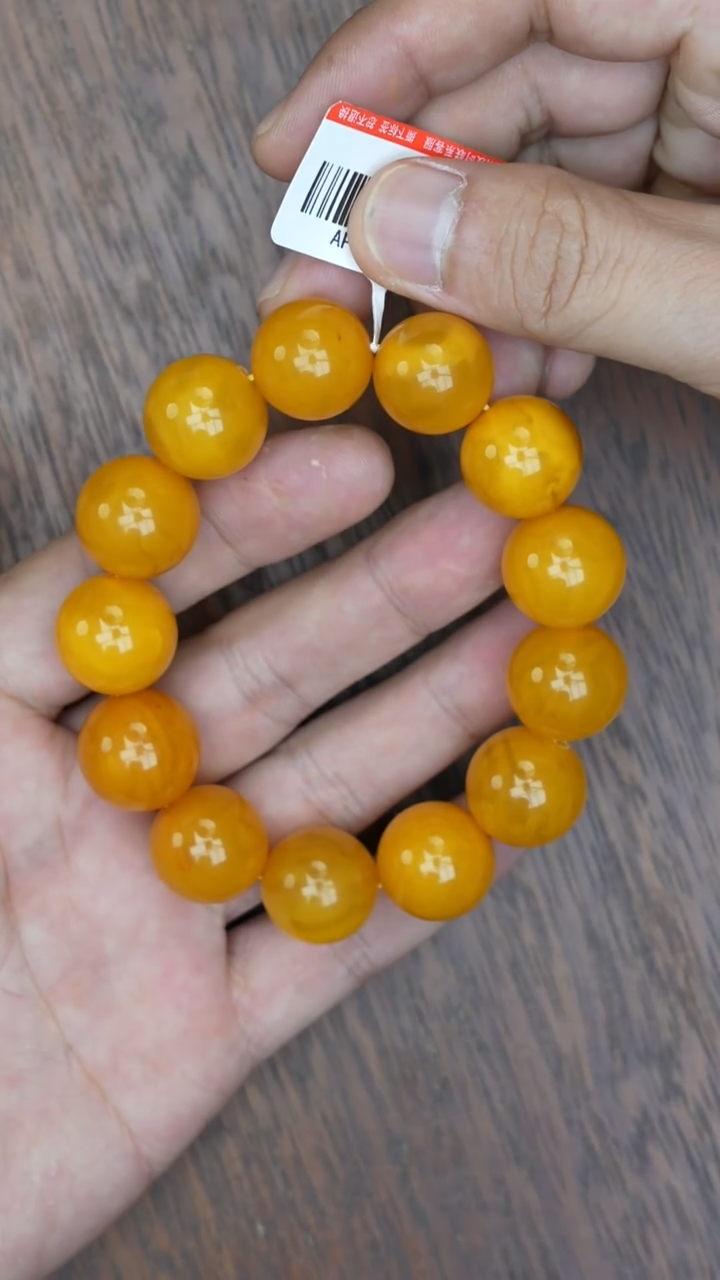【闪购商品】琥珀裸石未镶嵌老蜡亮面圆珠手串微瑕