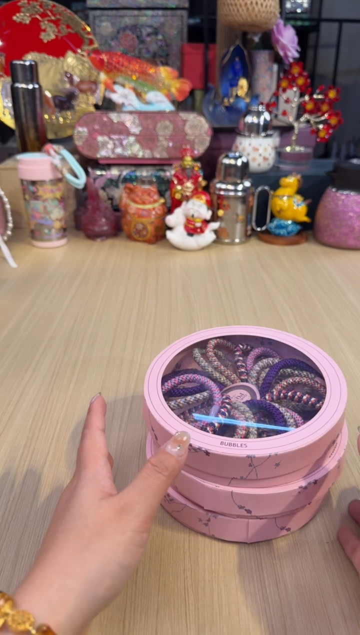 79粉色圆盒发圈-紫红橙