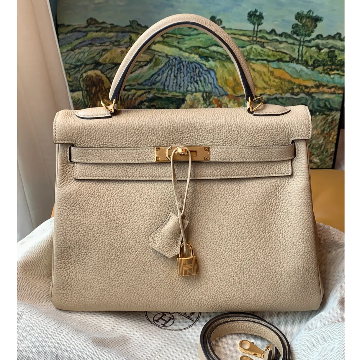99新 Hermes/爱马仕 小花JerryKelly 32 风衣灰 Togo皮X刻 金扣包