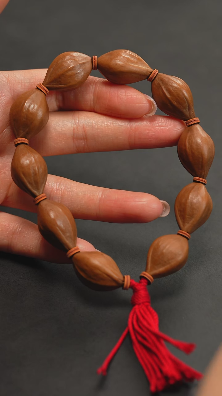 橄榄核手串三花三面佛素串