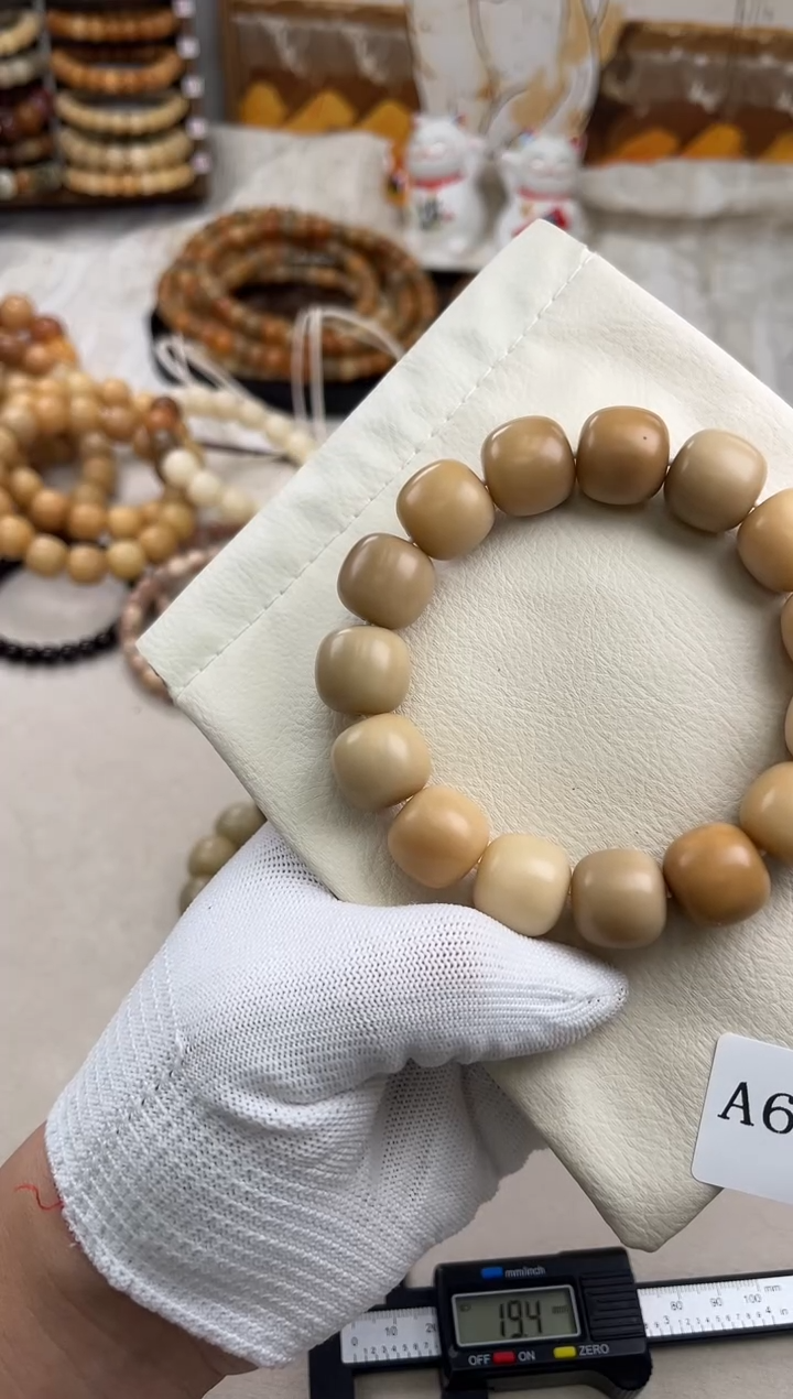 菩提根/象牙果手串羊*?a610卡17 瑕疵干磨奶咖老料