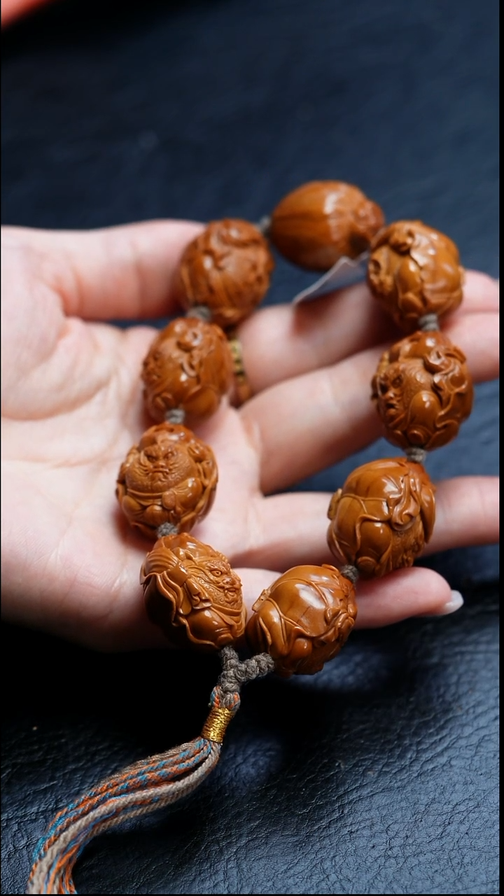 橄榄核吊坠成***头橄榄核