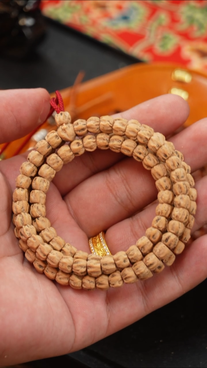 柏香籽/百香籽手串李****?红皮直切满鬼