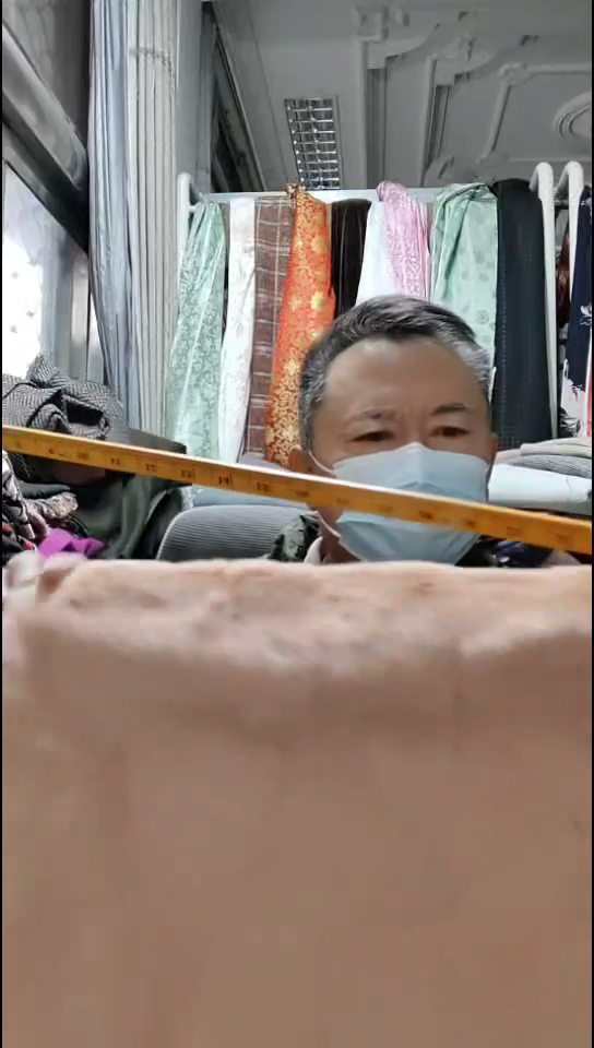 西柚色纯色毛毛花纹布料