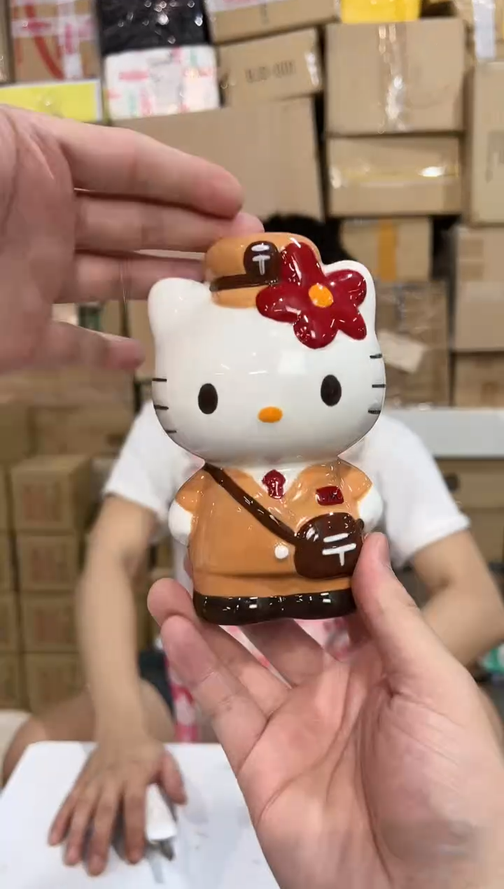 瓷片棕色kt猫邮递员存钱罐