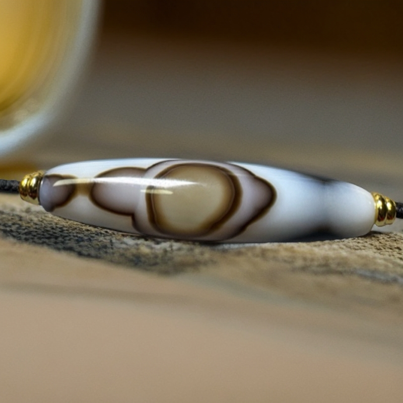 缠丝玛瑙一眼黄金瞳双牙54.9✖️13.8mm