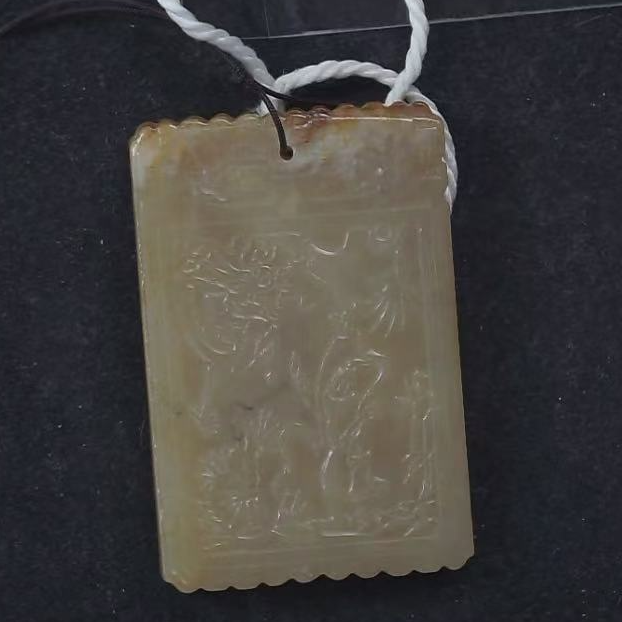 清代和田玉胡人戏兽子冈牌