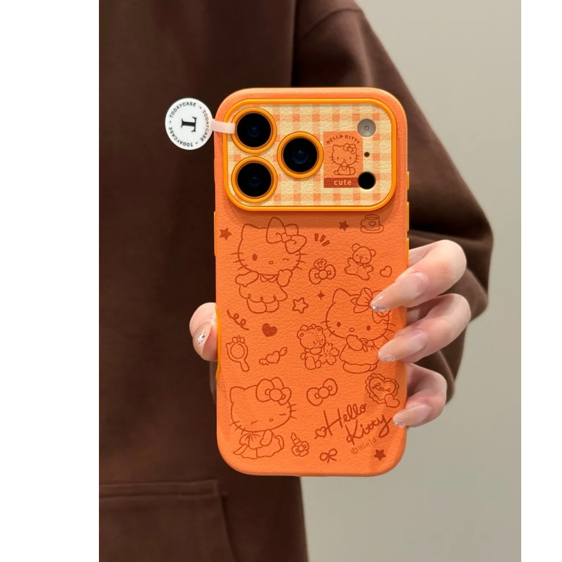 可爱橙色线条Kitty皮质手机壳适用iPhone17promax16秒变17摄像框