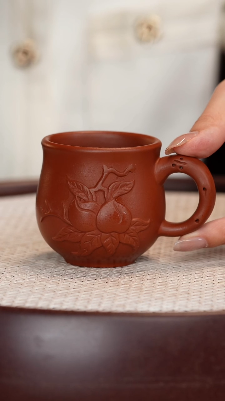 紫砂茶具大红袍寿桃带把杯