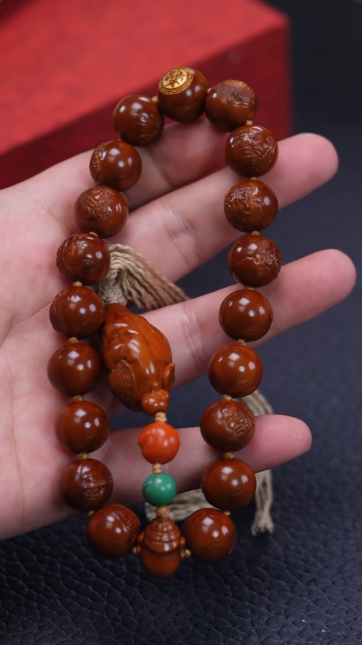 【闪购商品】橄榄核其他回血尘修本工正圆薄意雕十八罗汉手持