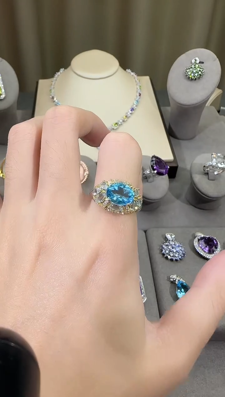 银S925镶嵌戒指托帕石10*8mm妖姬蓝戒指