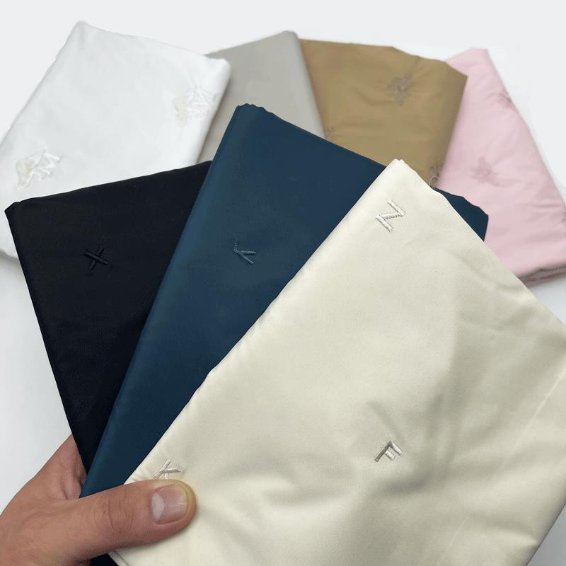 1米价绣花三合一服面料免胆布免绗缝棉衣棉裤直充绒纯色面料