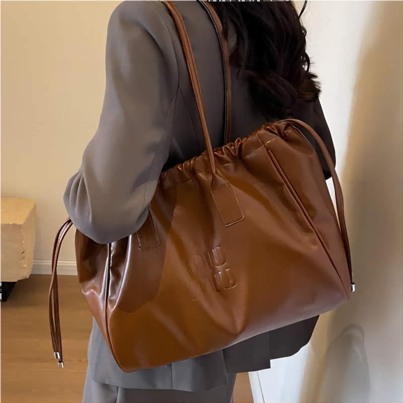 大容量百搭包包女2024新款复古单肩包简约质感女士通勤抽绳托特包