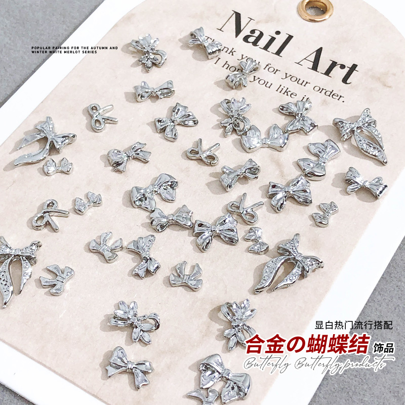 合金蝴蝶结美甲饰品网红新款银色立体飘带领结款爆闪指甲配饰