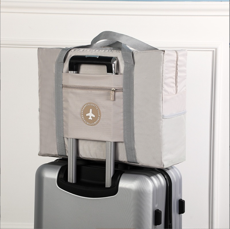 爆款小清新圆标飞机包 衣物整理行李旅行袋 大容量手提被子收纳袋