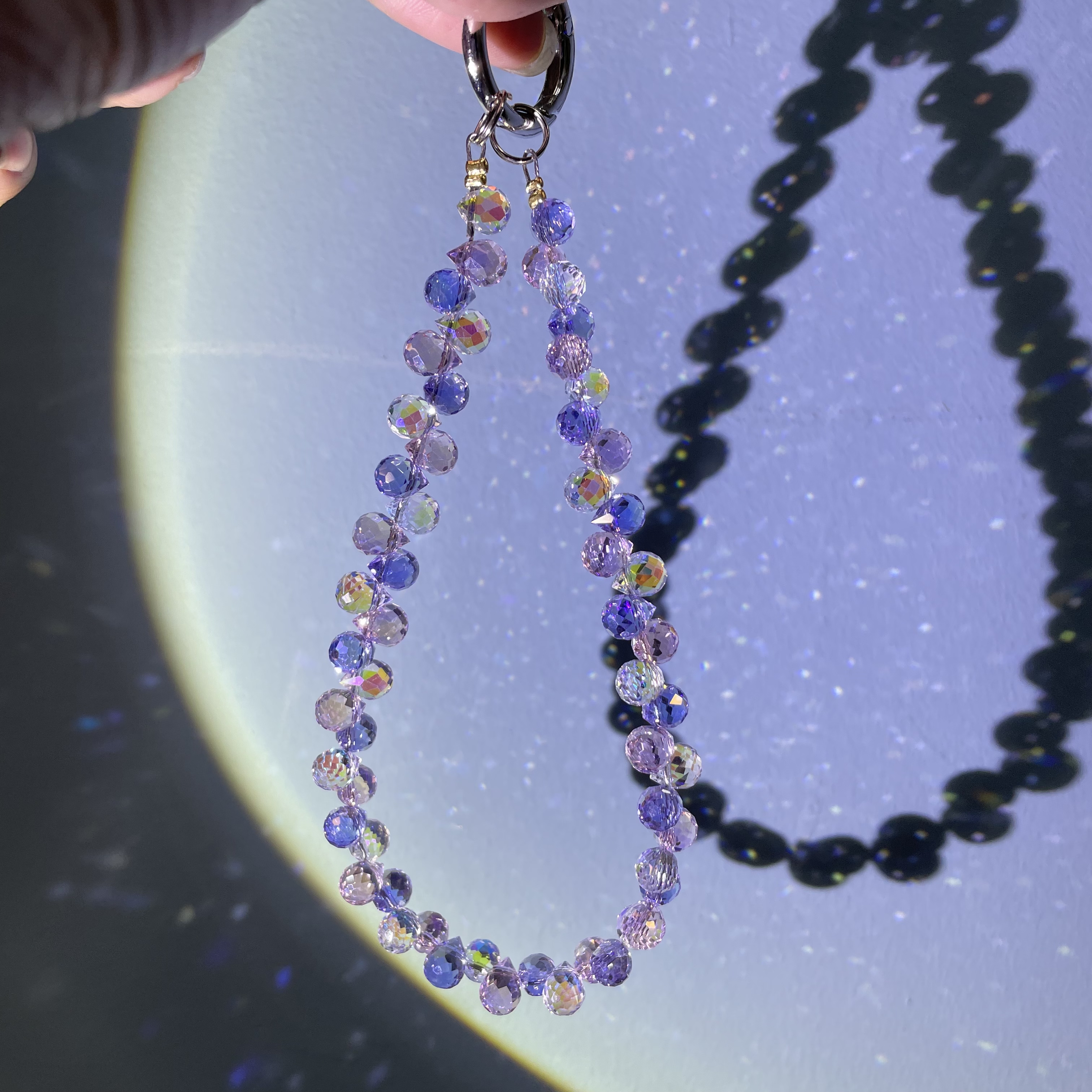 编织粉紫色双排水滴款手机链C560