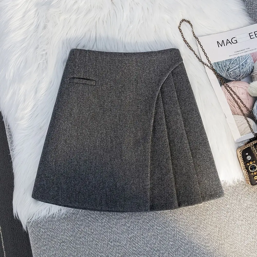  高级感灰色加厚毛呢a字半身裙秋冬2025新款高腰不规则百褶裙短裙
