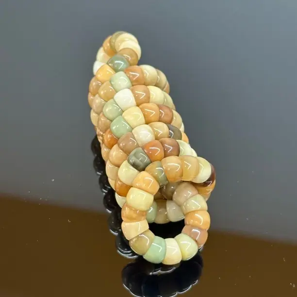 龙脊菩提半玉化多宝色0.8直切大肠