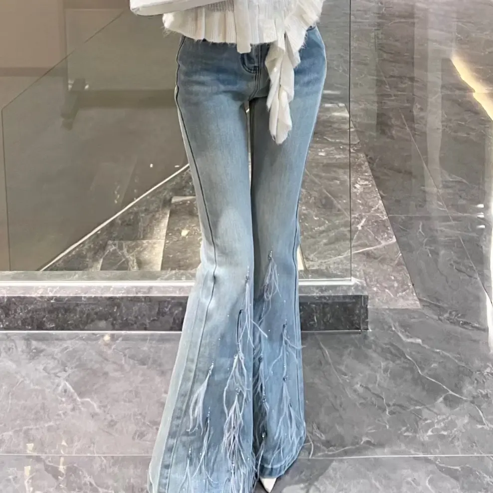 2025秋季新款裤型美学新定义邂逅仙系重工钉珠羽毛微喇牛仔长裤女