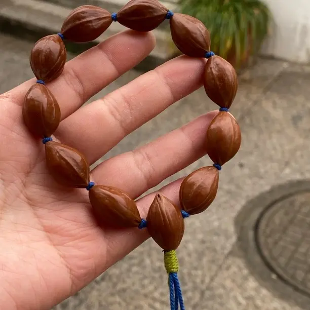 橄榄核老油核三面佛文玩手串，尺寸1.4×2.2左右