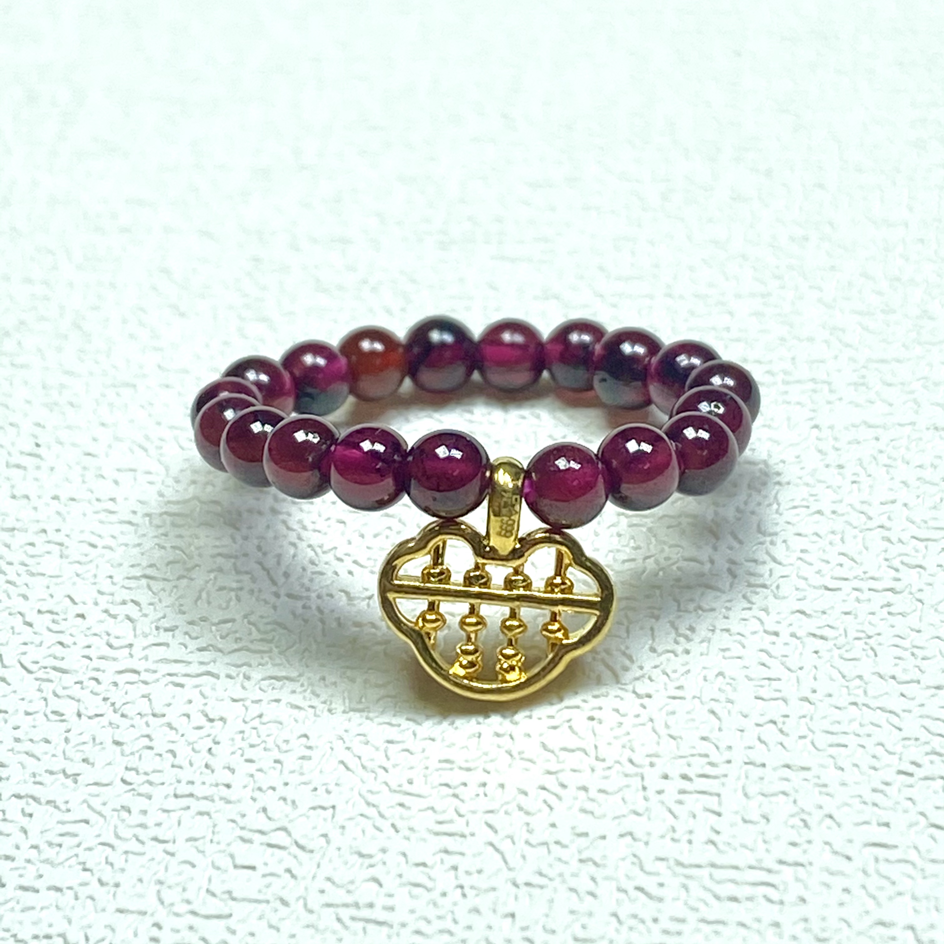 足金999小如意算盘搭石榴石戒指@@A143